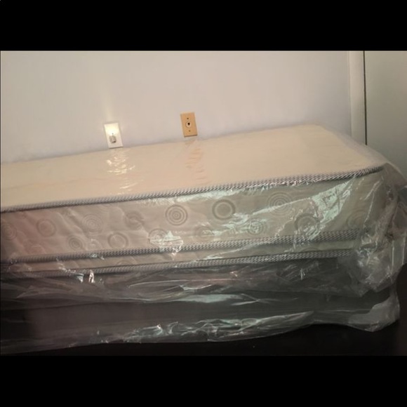 Brand new twin bed still in plastic